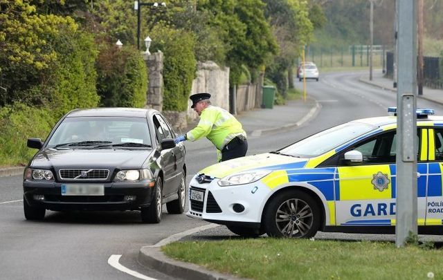 Gardai monitoring cars at a checkpoint on April 10, 2020 during Operation Fanacht.