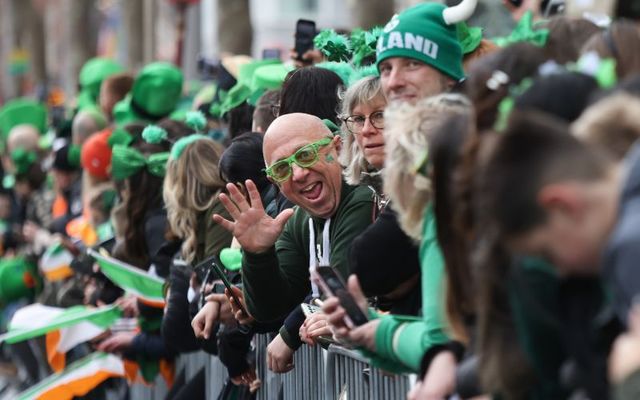 March 17, 2023:  A happy crowd member waves to the camera during the St. Patrick\'s Day Parade in Dublin. 