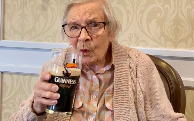 Sláinte, Kathleen! The centenarian raises a pint for her 105th birthday.