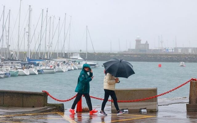 September 27, 2023: People on Howth Pier in Dublin during Storm Agnes.