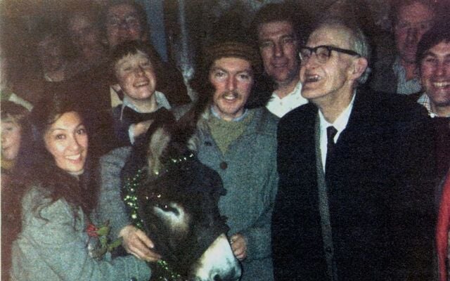 (L to R): Belita, Donal Rattigan, Missie the donkey, Kevin, and Headmaster Dan D’Alton inside Rattigan’s Pub.