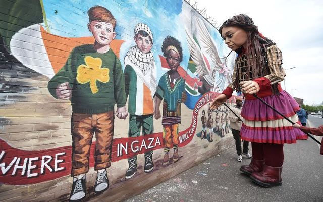 May 17, 2024: Little Amal makes her way along the Peace Walls guided by children from all sides of the community during a four-day visit in Belfast, Northern Ireland. 