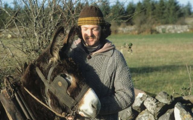 Kevin O\'Hara and his donkey on the road in Ireland.