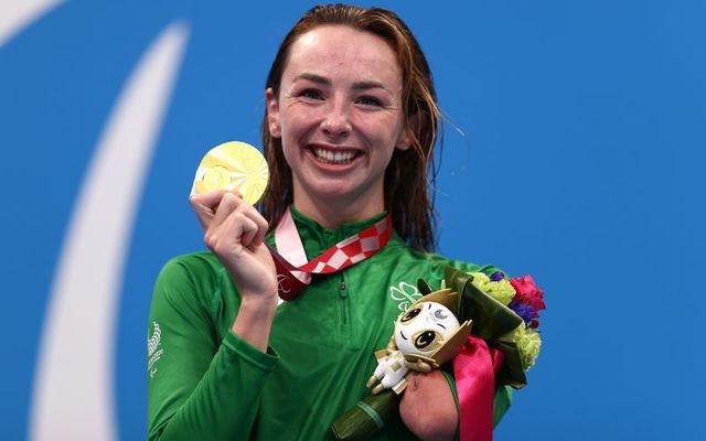 August 26, 2021: Gold medalist Ellen Keane of Team Ireland celebrates on the podium at the medal ceremony for the Women\'s 100m Breaststroke - SB8 on day 2 of the Tokyo 2020 Paralympic Games at the Tokyo Aquatics Centre in Tokyo, Japan.