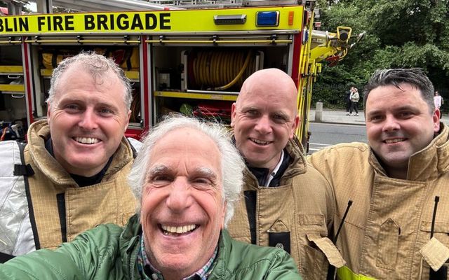 June 12, 2024: Henry Winkler grabs a selfie with members of the Dublin Fire Brigade after he was evacuated from The Shelbourne Hotel.