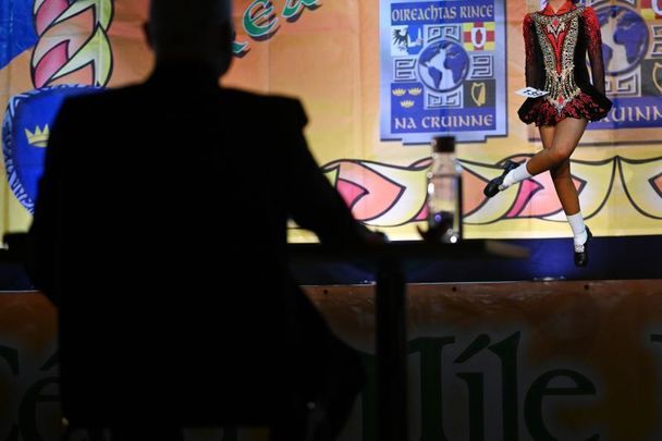 April 10, 2022:  A judge watches a competitor during the opening day of the World Irish Dancing Championships at the Waterfront Hall in Belfast, Northern Ireland.