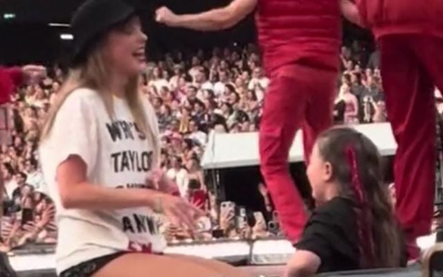 June 30, 2024: Cork girl Clara O\'Sullivan meets Taylor Swift and receives her \"22\" hat during the Eras Tour concert in Dublin\'s Aviva Stadium.