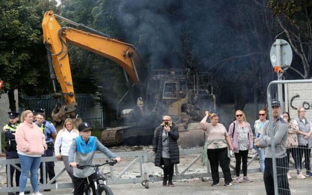 A burnt-out digger following Monday\'s protest. 