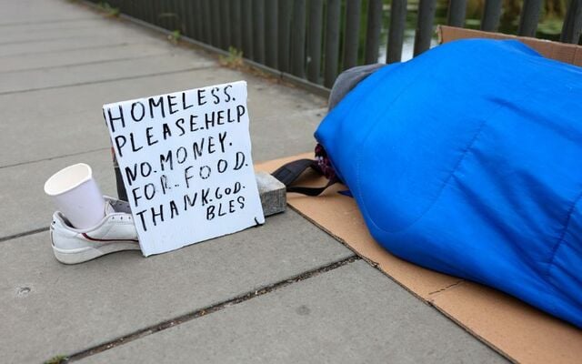 June 30, 2023: A person in a sleeping bag with by the canal in Dublin.