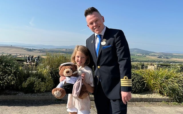 Staff Captain Brian Whelan with little Sophie Callaghan and her best pal, Rabbie and a Princess Cruises teddy bear.