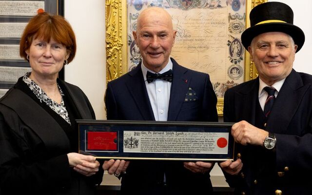 Fr Bernárd Lynch receiving his Freedom of the City of London from officials at The Guildhall London.