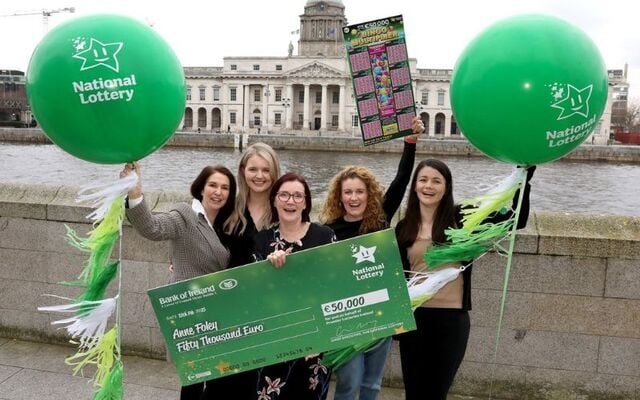 Déjà vu! Anne Foley collects her National Lottery winnings.