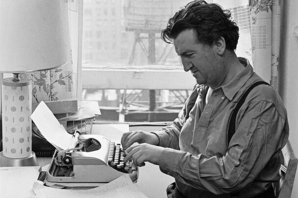 Brendan Behan photographed hard at work in c. 1955.