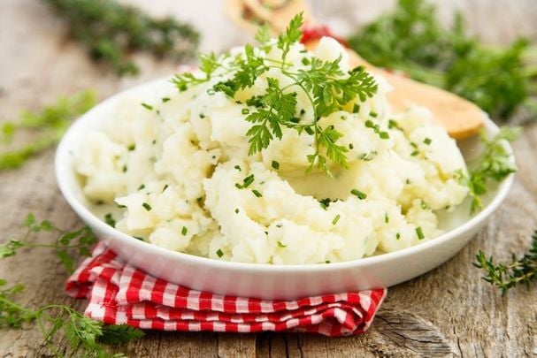 A bowl of delicious champ, made with potatoes, green onions, milk and butter.