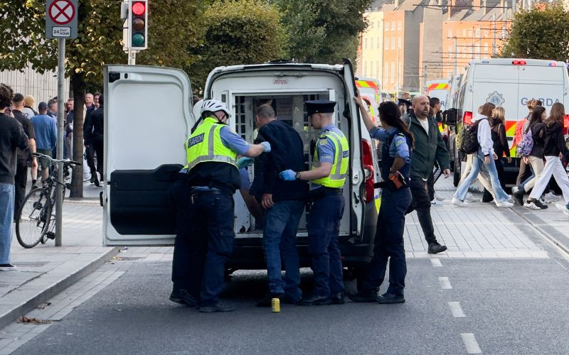 September 19, 2024: Members of An Garda Síochána place a man in a Garda van on O'Connell Street. (RollingNews.ie)